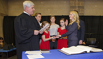 Monmouth County Clerk Christine Giordano Hanlon is administered the oath of office by Superior Court Judge Joseph W. Oxley at Monmouth County’s 2016 Organization Day on Jan. 6, 2016 at Biotechnology High School in Freehold Township.  Hanlon was sworn in to her first elected term in office as County Clerk. 